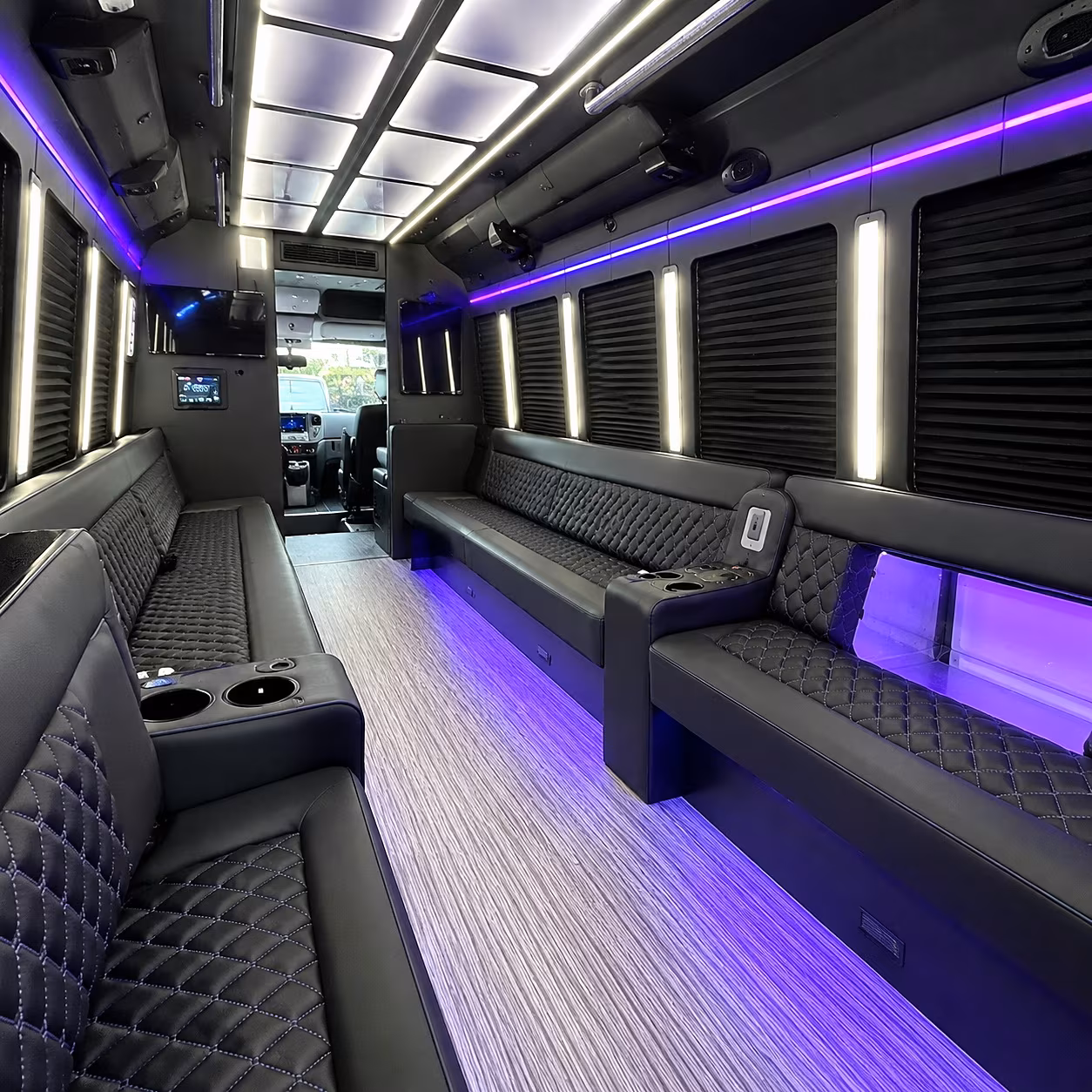Wedding guests seated inside a party bus serving Nashville